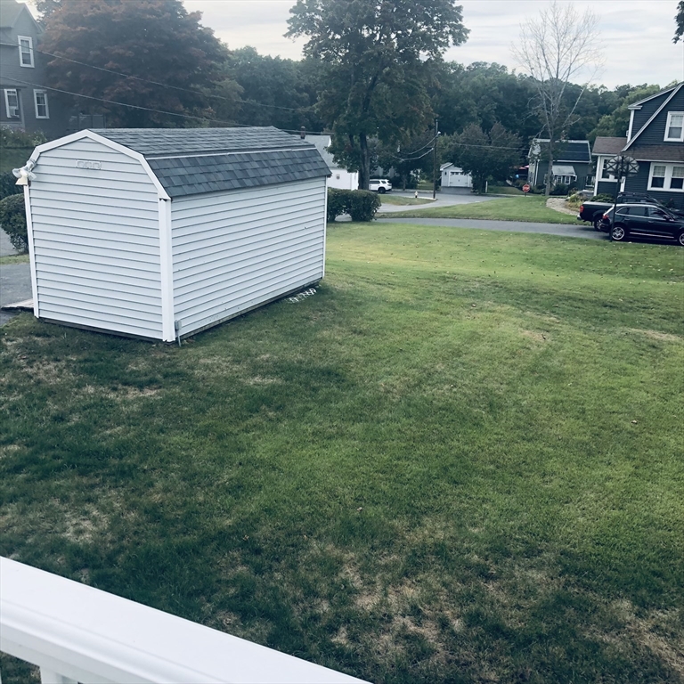 118 Chace Street Clinton, MA 01510 - Photo 7 of 41 a view of a white house with a sink and yard