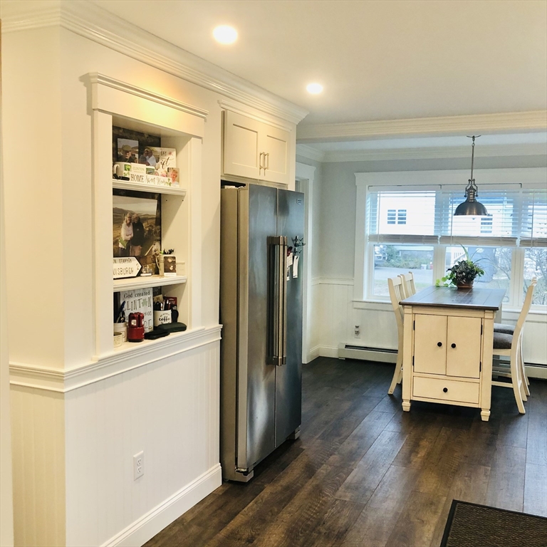 118 Chace Street Clinton, MA 01510 - Photo 10 of 41 a kitchen with stainless steel appliances a refrigerator and cabinets
