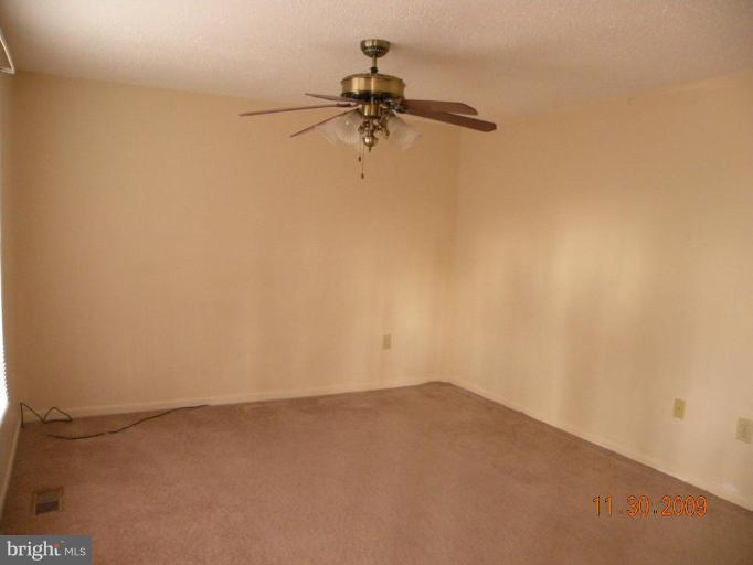 645 Willow Road Lusby, MD 20657 - Photo 5 of 7 Living room with ceiling fan