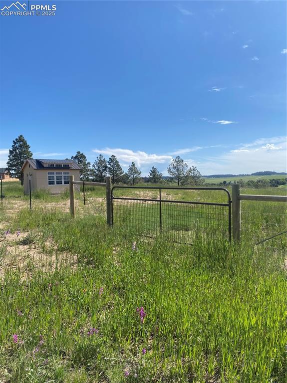 13435 Hodgen Road Elbert, CO 80106 - Photo 21 of 24 a view of a lake with a big yard