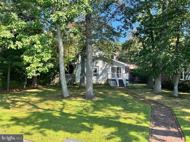 26 Silver Lake Road Clayton, NJ 08312 - Photo 6 of 15 a view of a house with a yard porch and sitting area