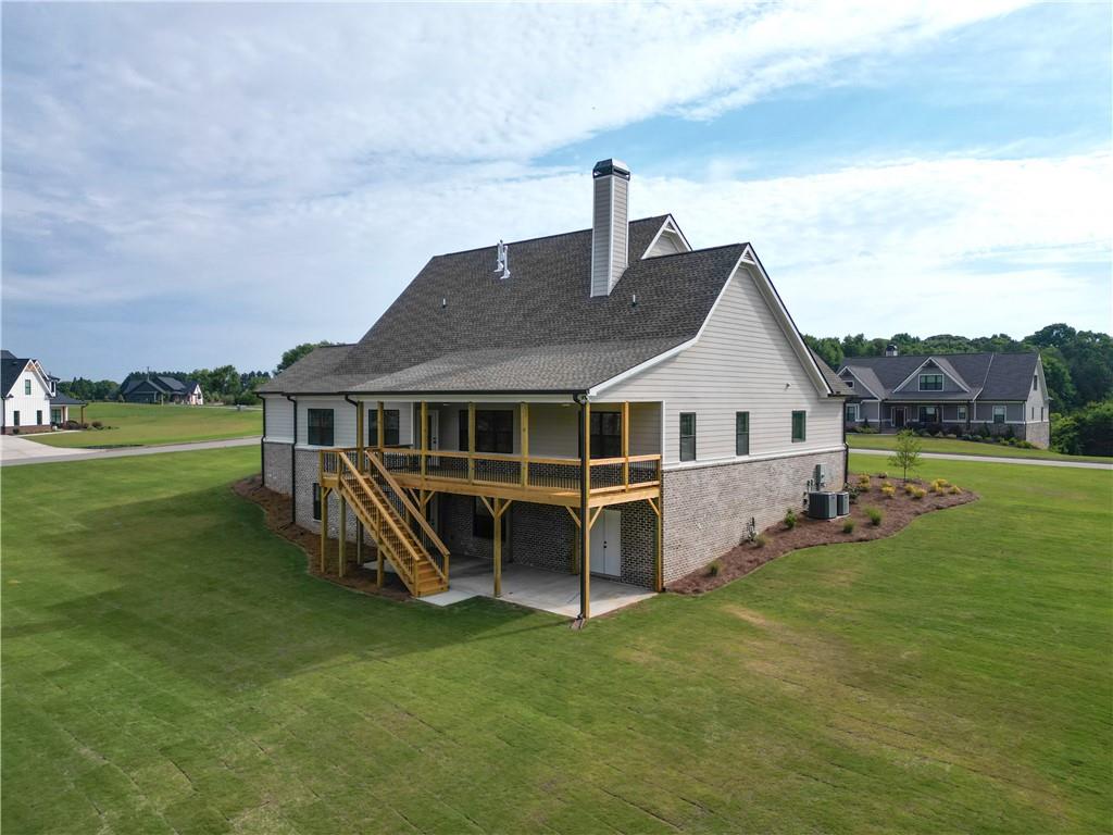 2113 Stonegate Way Monroe, GA 30656 - Photo 6 of 43 a front view of a house with garden