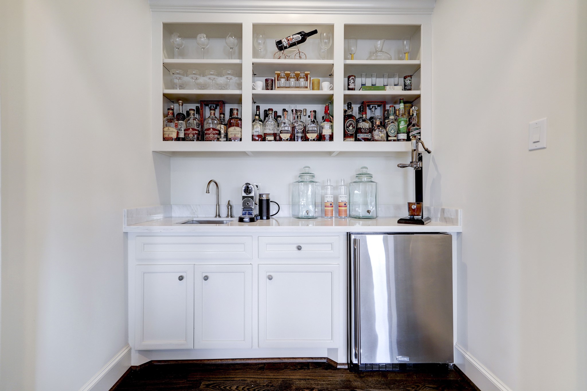 5218 Crawford Street Houston, TX 77004 - Photo 12 of 22 a view of storage and utility room with racks on the wall