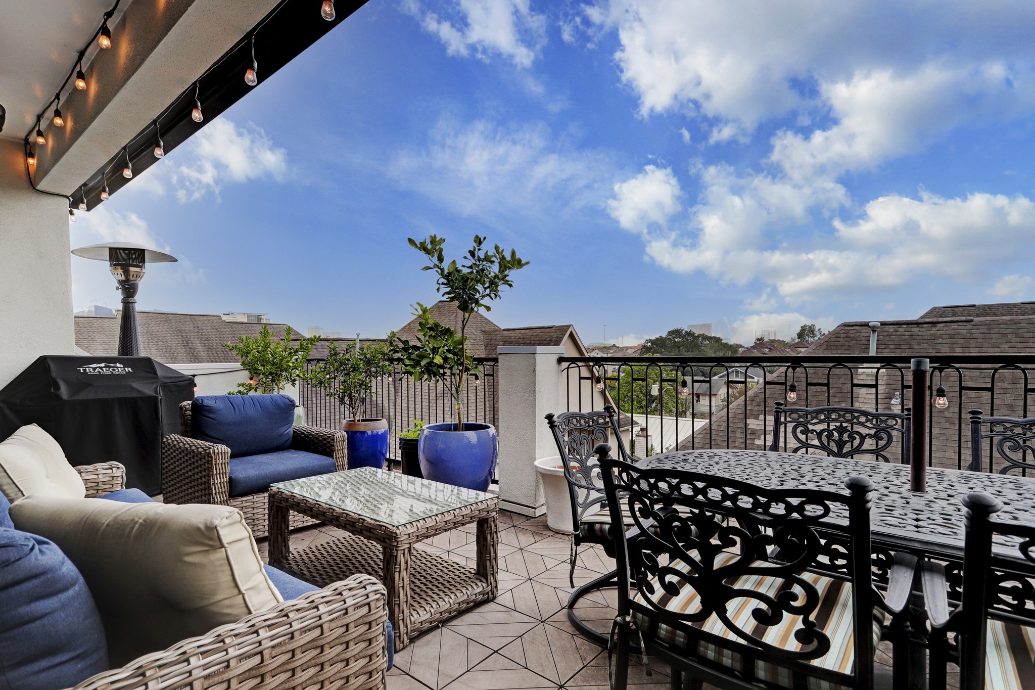 5218 Crawford Street Houston, TX 77004 - Photo 3 of 22 a roof deck with table and chairs