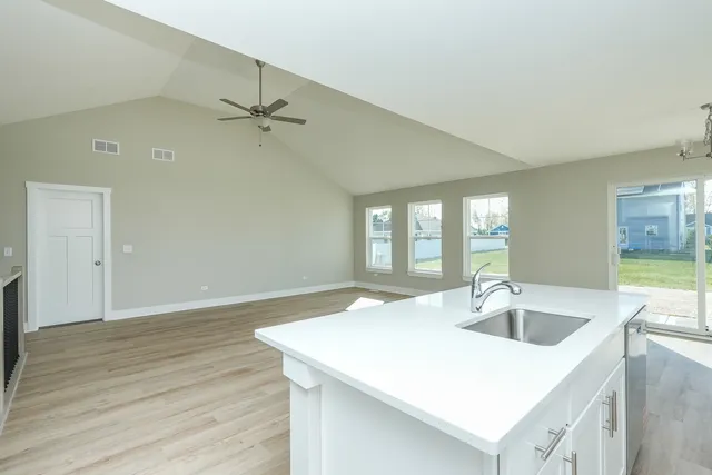 a small space with wooden floor and a window