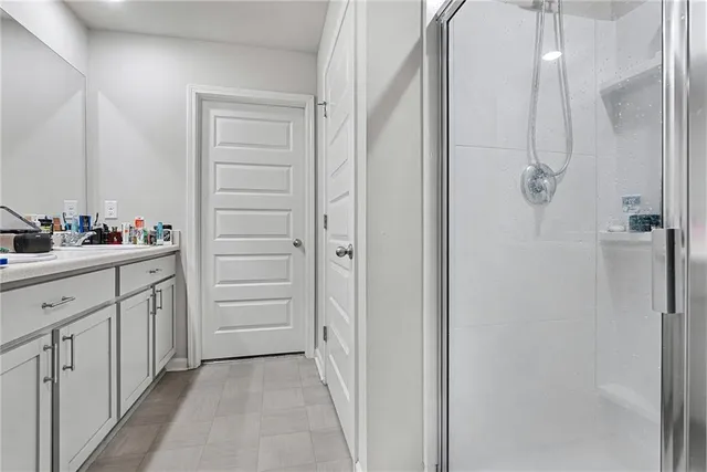 a bathroom with a double vanity sink a vanity and a mirror