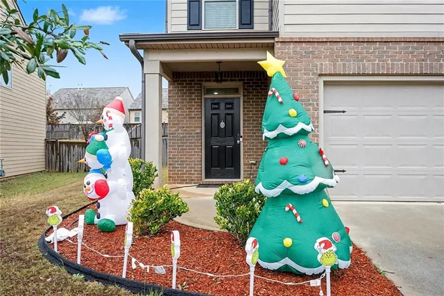 a front view of a house with outdoor seating