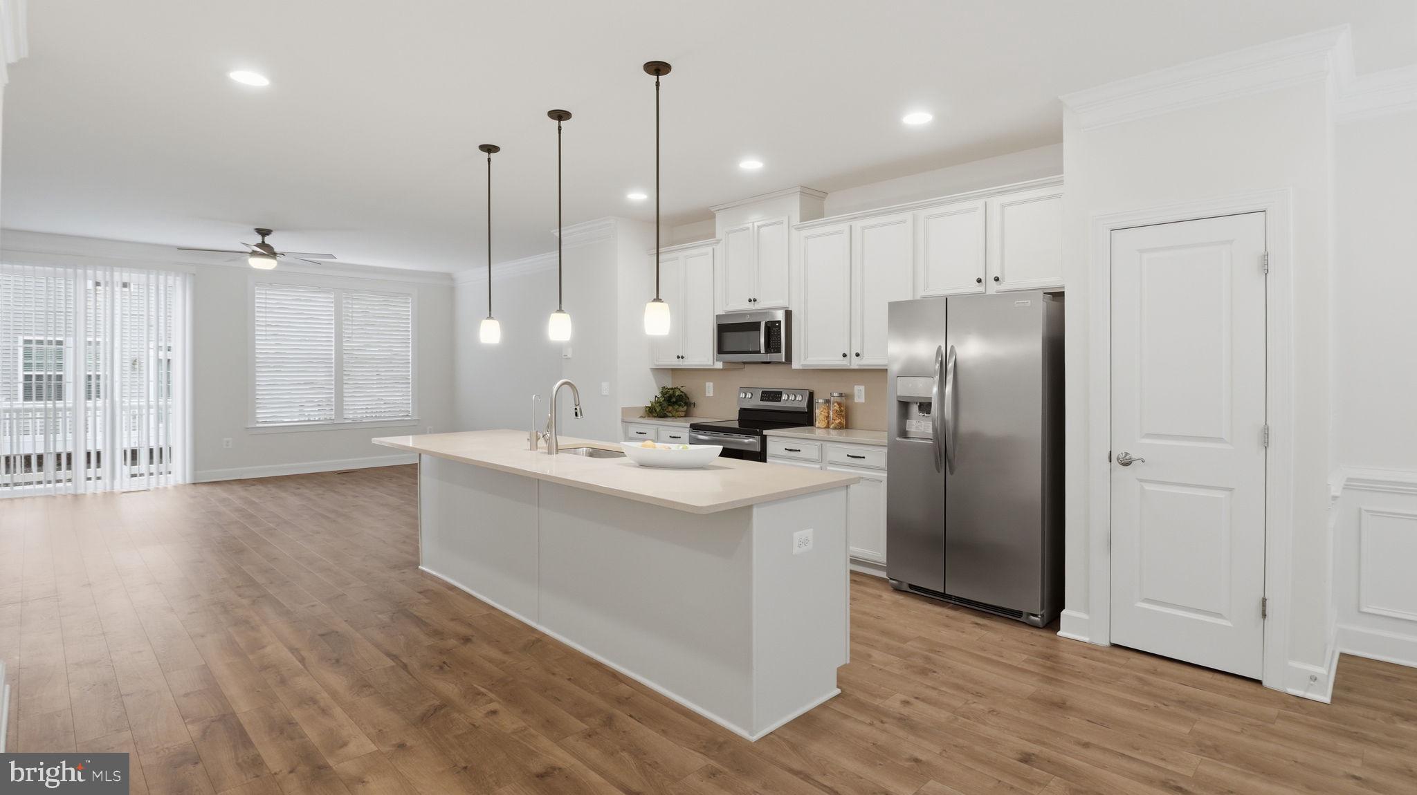 13806 Litespeed Way Gainesville, VA 20155 - Photo 15 of 22 a kitchen with stainless steel appliances granite countertop a refrigerator a sink dishwasher a stove and a wooden floors