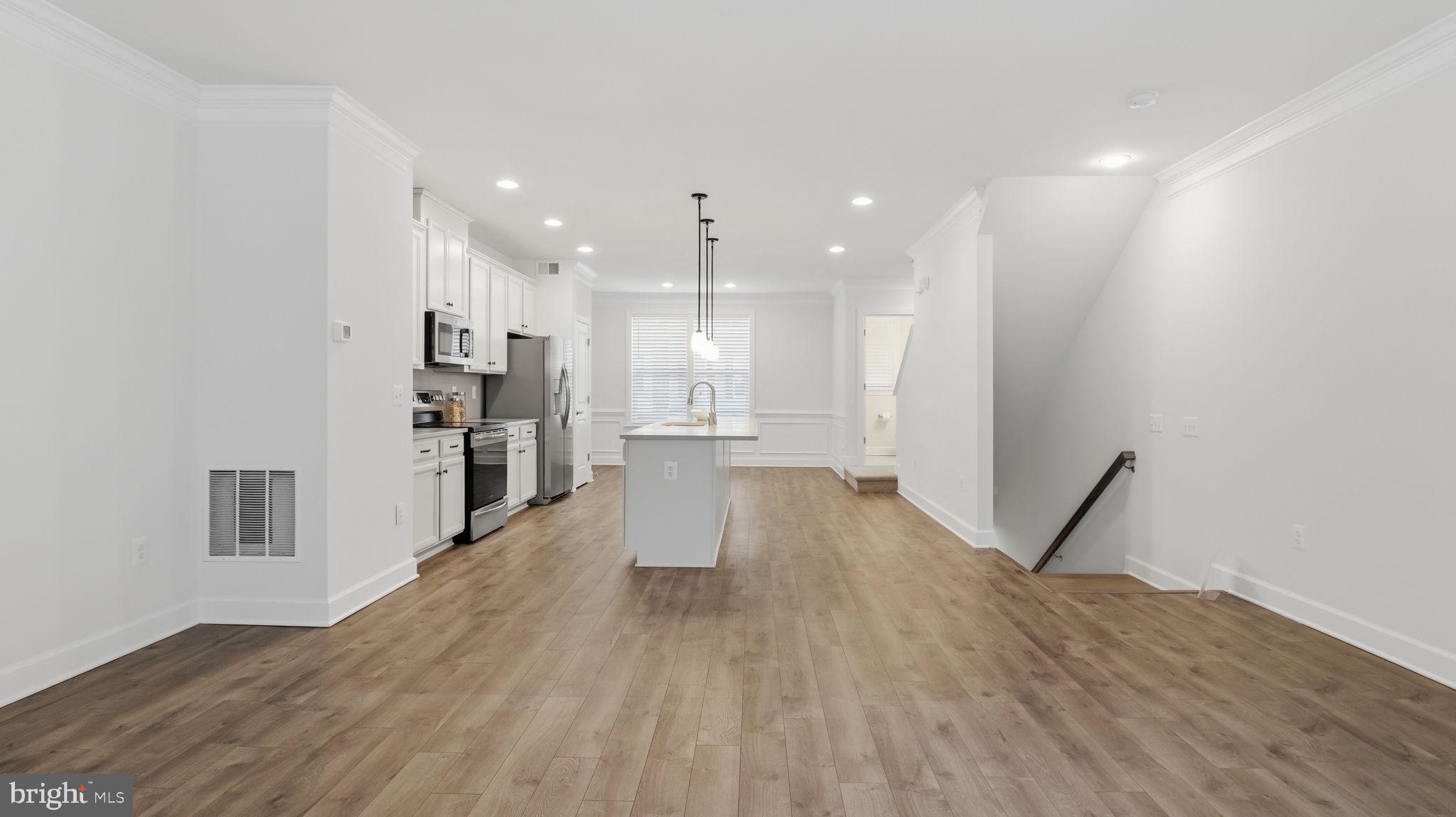 13806 Litespeed Way Gainesville, VA 20155 - Photo 17 of 22 a view of a kitchen with wooden floor and a window