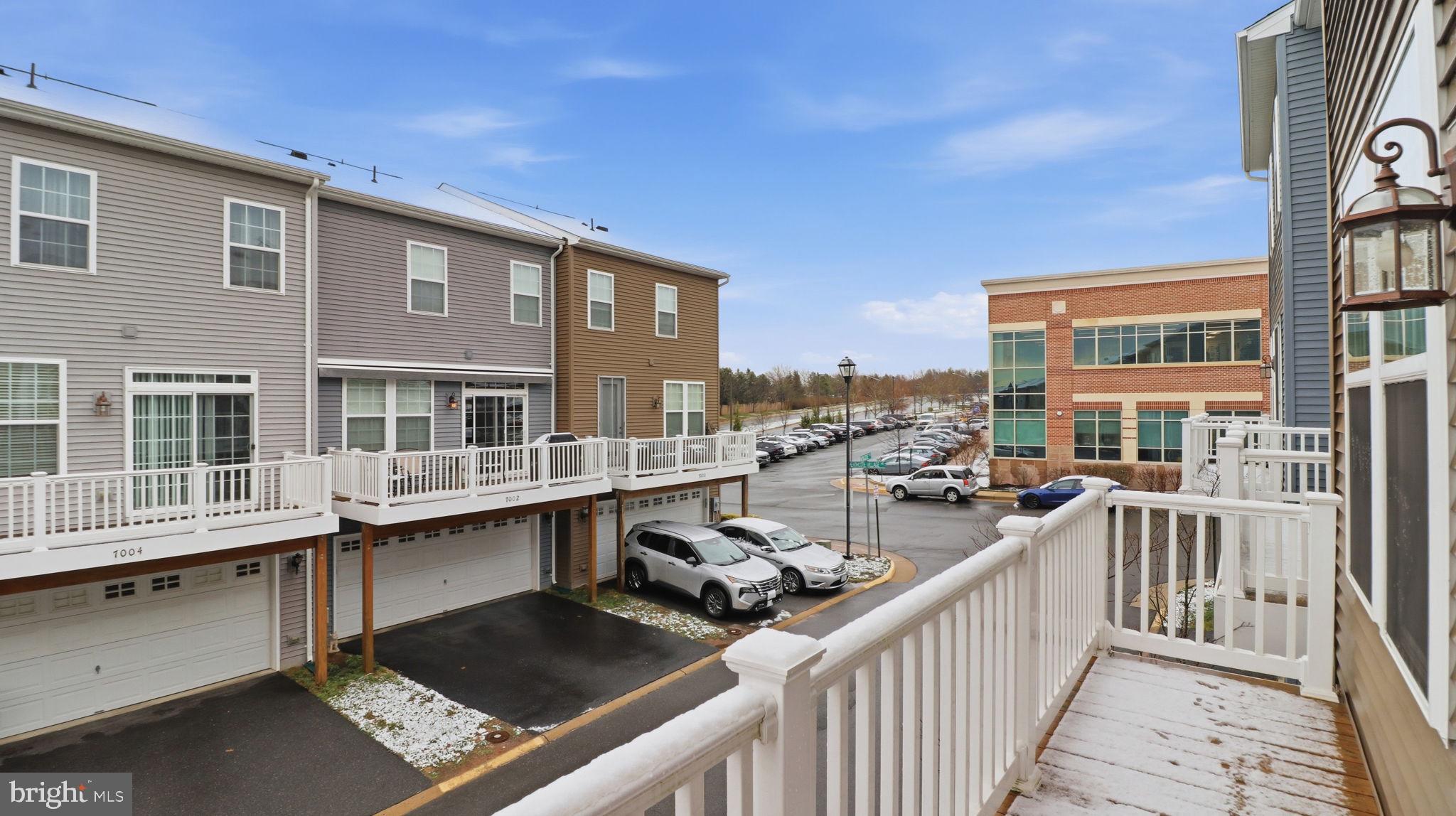 13806 Litespeed Way Gainesville, VA 20155 - Photo 21 of 22 a view of a balcony with two chairs and a barbeque