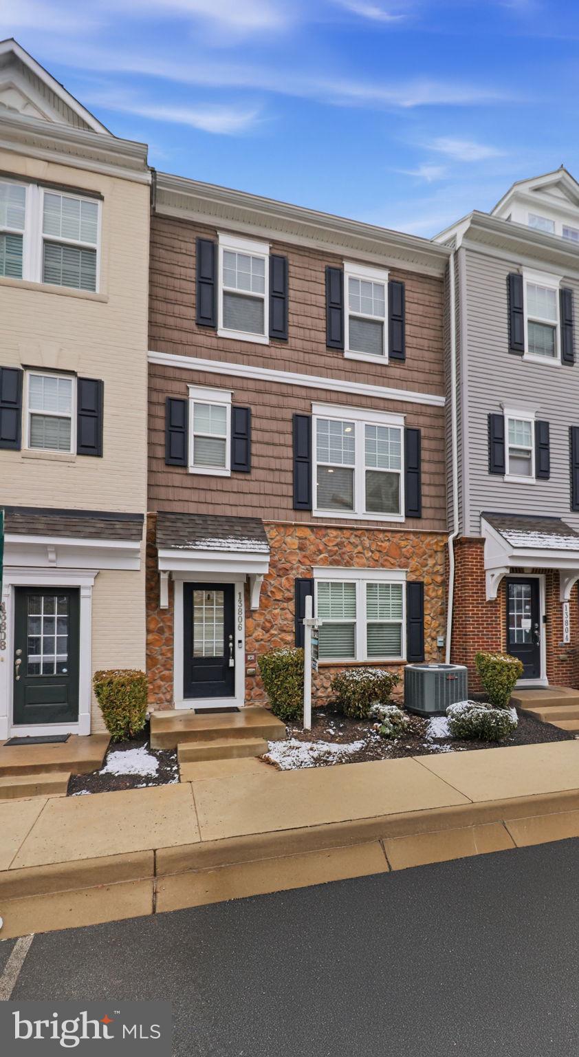 13806 Litespeed Way Gainesville, VA 20155 - Photo 4 of 22 a front view of a building with street