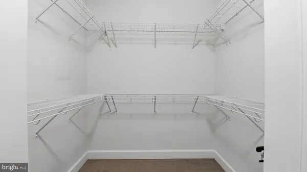 a view of a room with racks on the wall