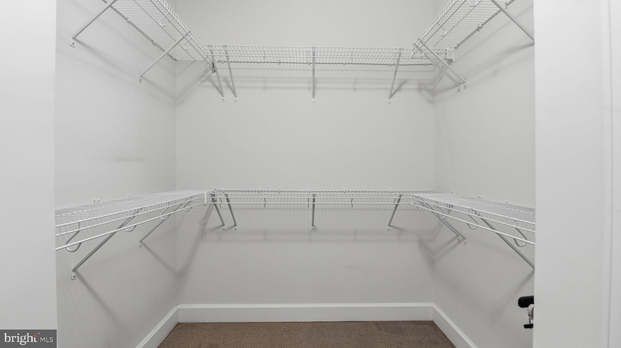 13806 Litespeed Way Gainesville, VA 20155 - Photo 8 of 22 a view of a room with racks on the wall