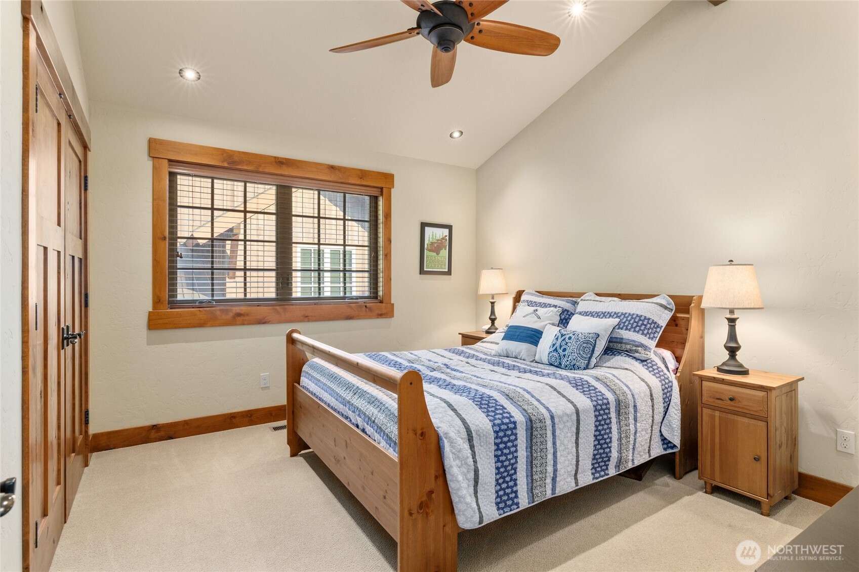223 Cake Cle Elum, WA 98922 - Photo 23 of 33 a bedroom with a bed and a chandelier