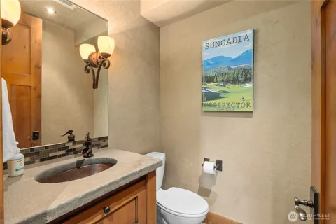 a living room with furniture and a rug