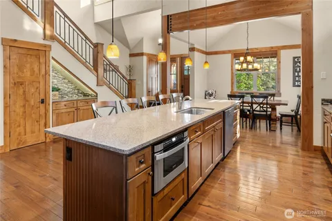 a kitchen with a stove and a kitchen island