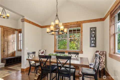 a dining room with furniture and window