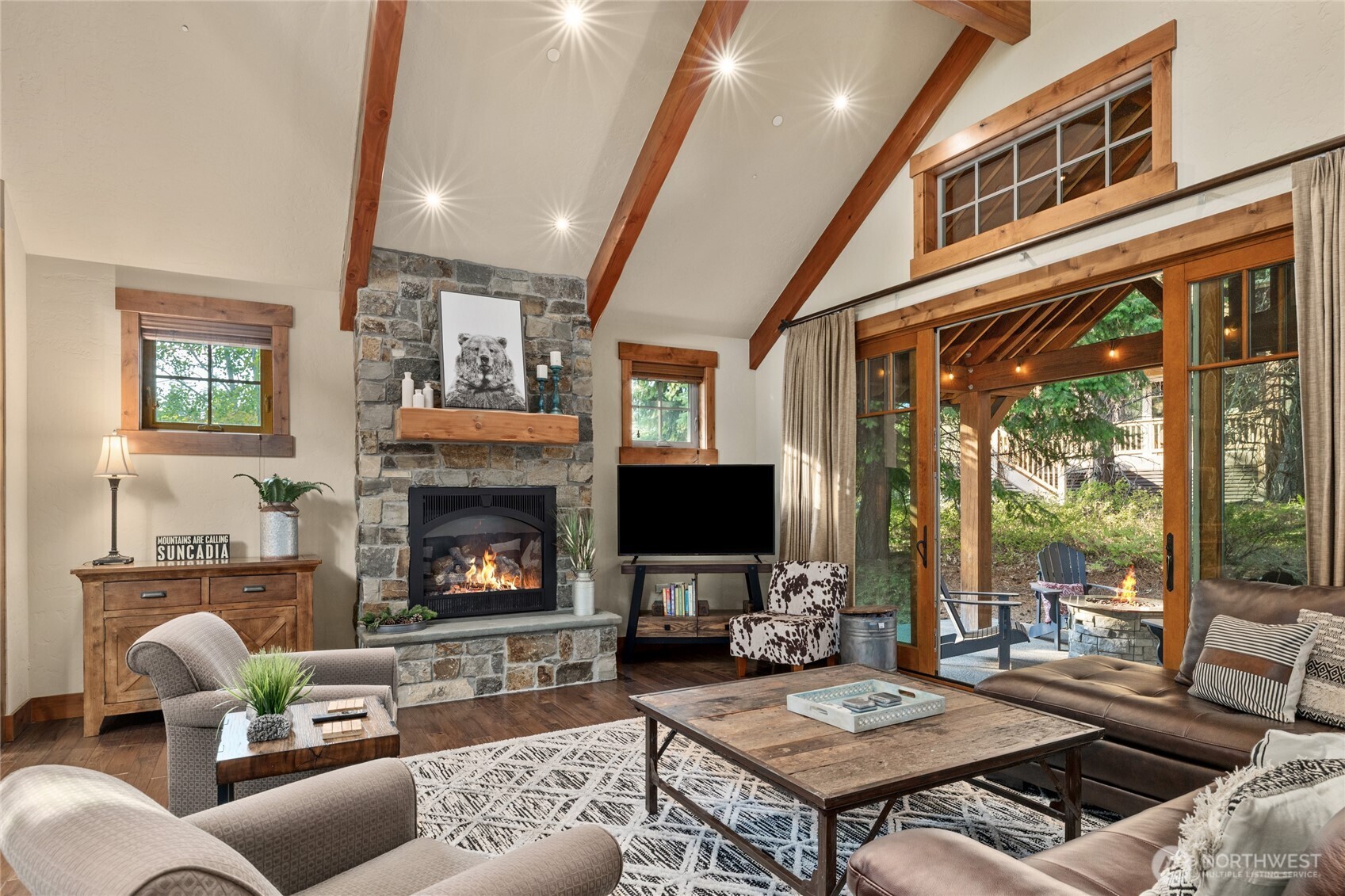 223 Cake Cle Elum, WA 98922 - Photo 10 of 33 a living room with furniture a fireplace and a flat screen tv