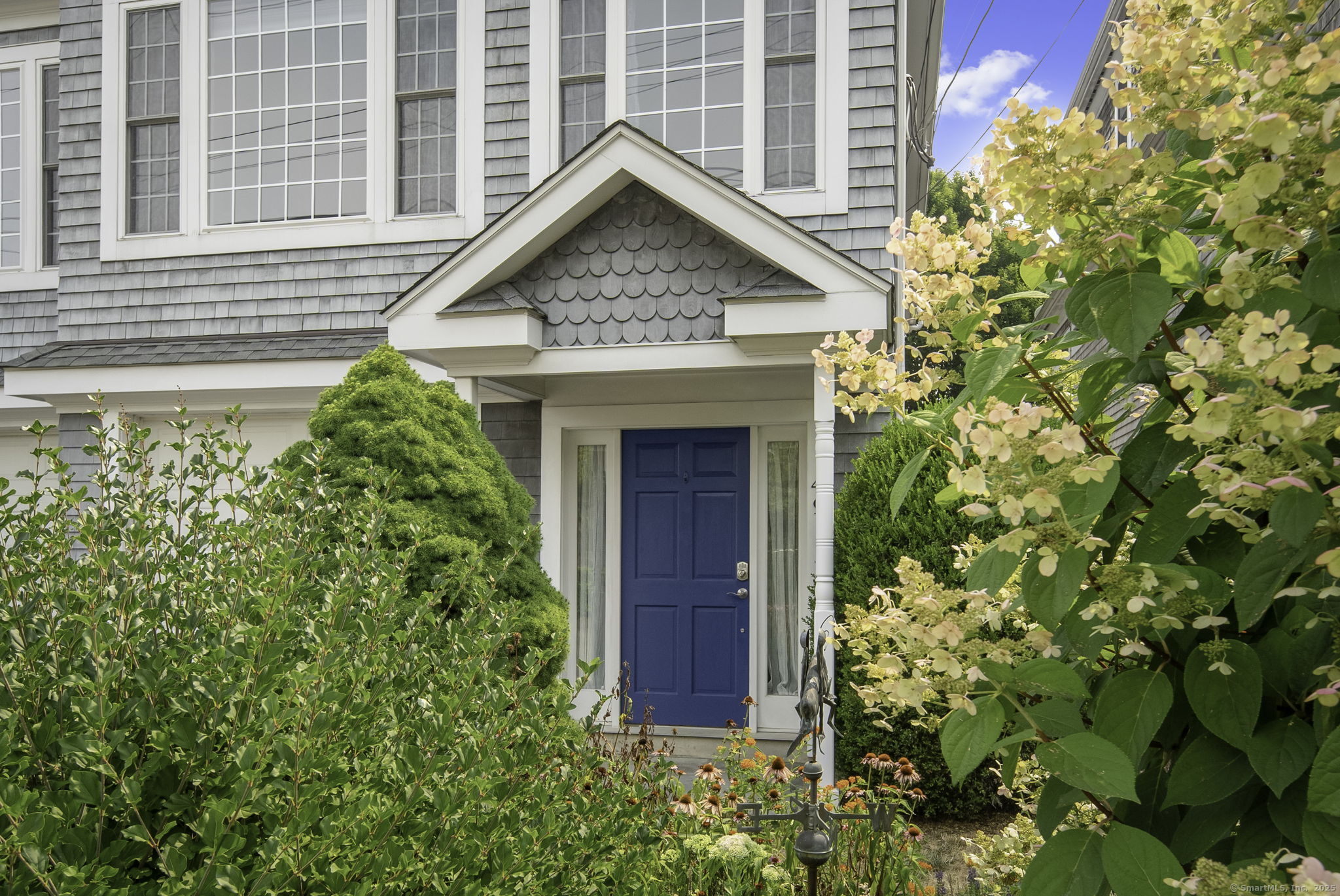 49 Thorpe Street Fairfield, CT 06824 - Photo 1 of 1 a front view of a house with garden