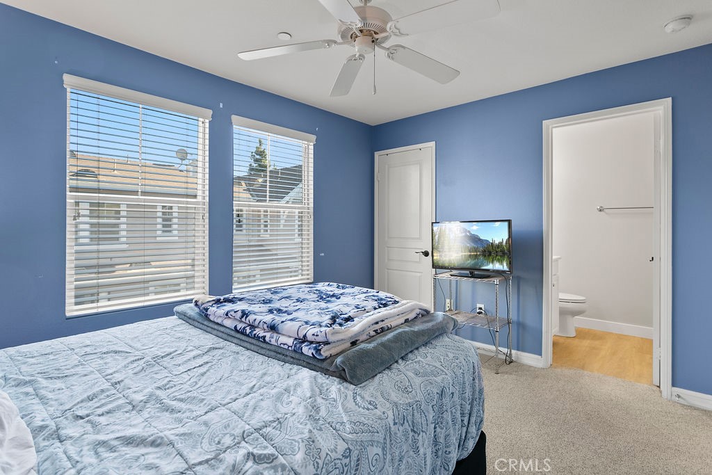 18 Triad Lane Ladera Ranch, CA 92694 - Photo 22 of 37 a bedroom with a bed and a chandelier