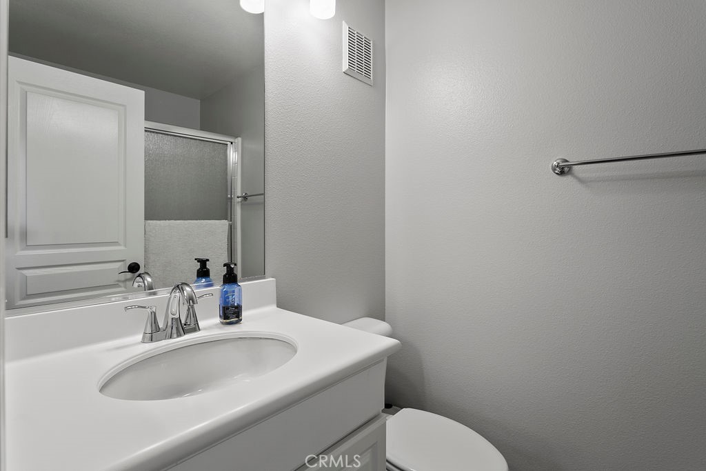 18 Triad Lane Ladera Ranch, CA 92694 - Photo 23 of 37 a bathroom with a sink toilet and mirror