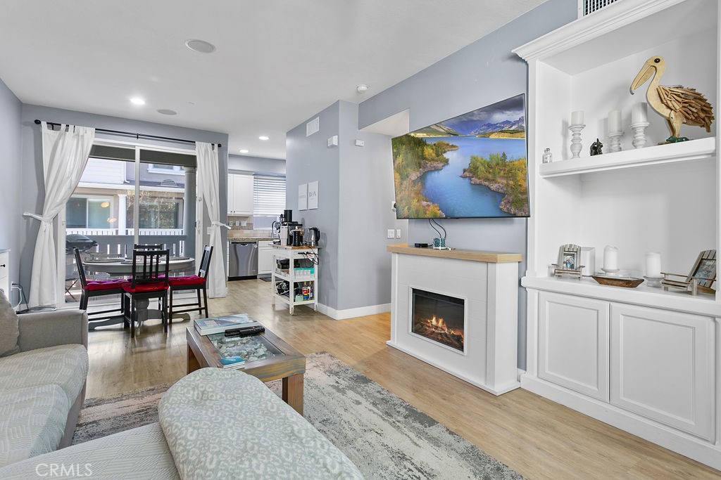 18 Triad Lane Ladera Ranch, CA 92694 - Photo 9 of 37 a living room with furniture a fireplace and a window
