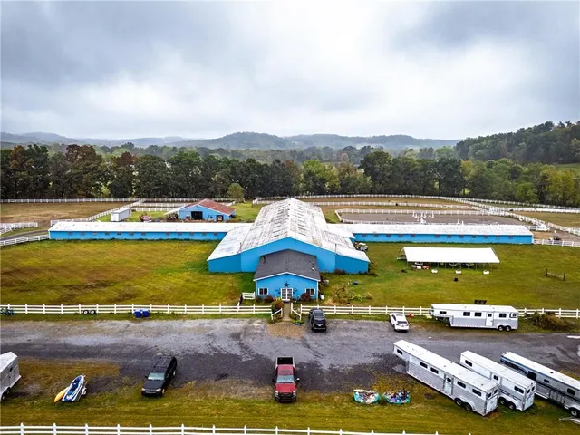 a view of an outdoor space with swimming pool and mountains in the back
