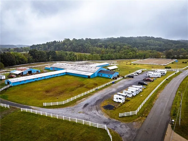 an aerial view of a pool an ocean view