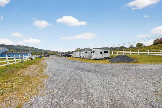 a kitchen with stainless steel appliances a stove refrigerator sink and cabinets