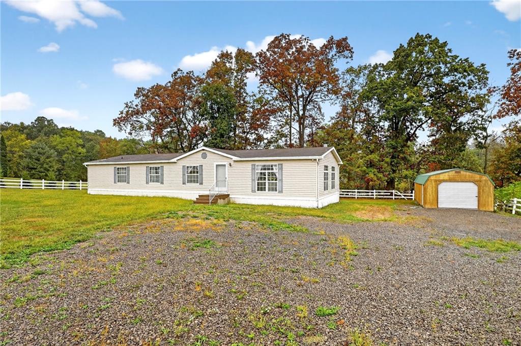 332 Overbrook Road Valencia, PA 16059 - Photo 36 of 50 a front view of house with yard space and trees in the background