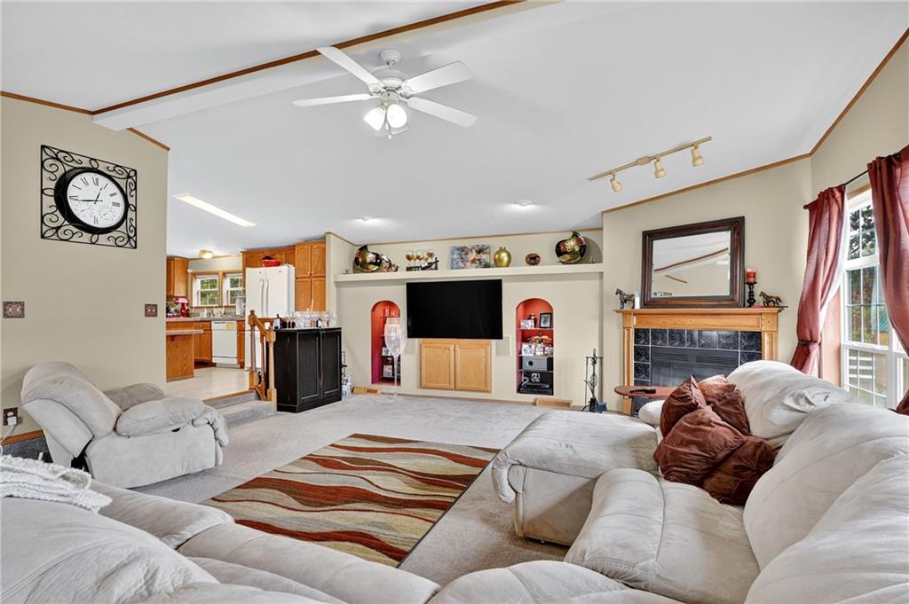 332 Overbrook Road Valencia, PA 16059 - Photo 38 of 50 a living room with furniture kitchen and a flat screen tv