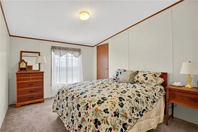 a view of a lake with table and chairs