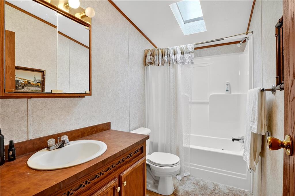 332 Overbrook Road Valencia, PA 16059 - Photo 46 of 50 a bathroom with a sink toilet a mirror and shower