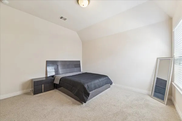 a living room with a couch and a flat screen tv