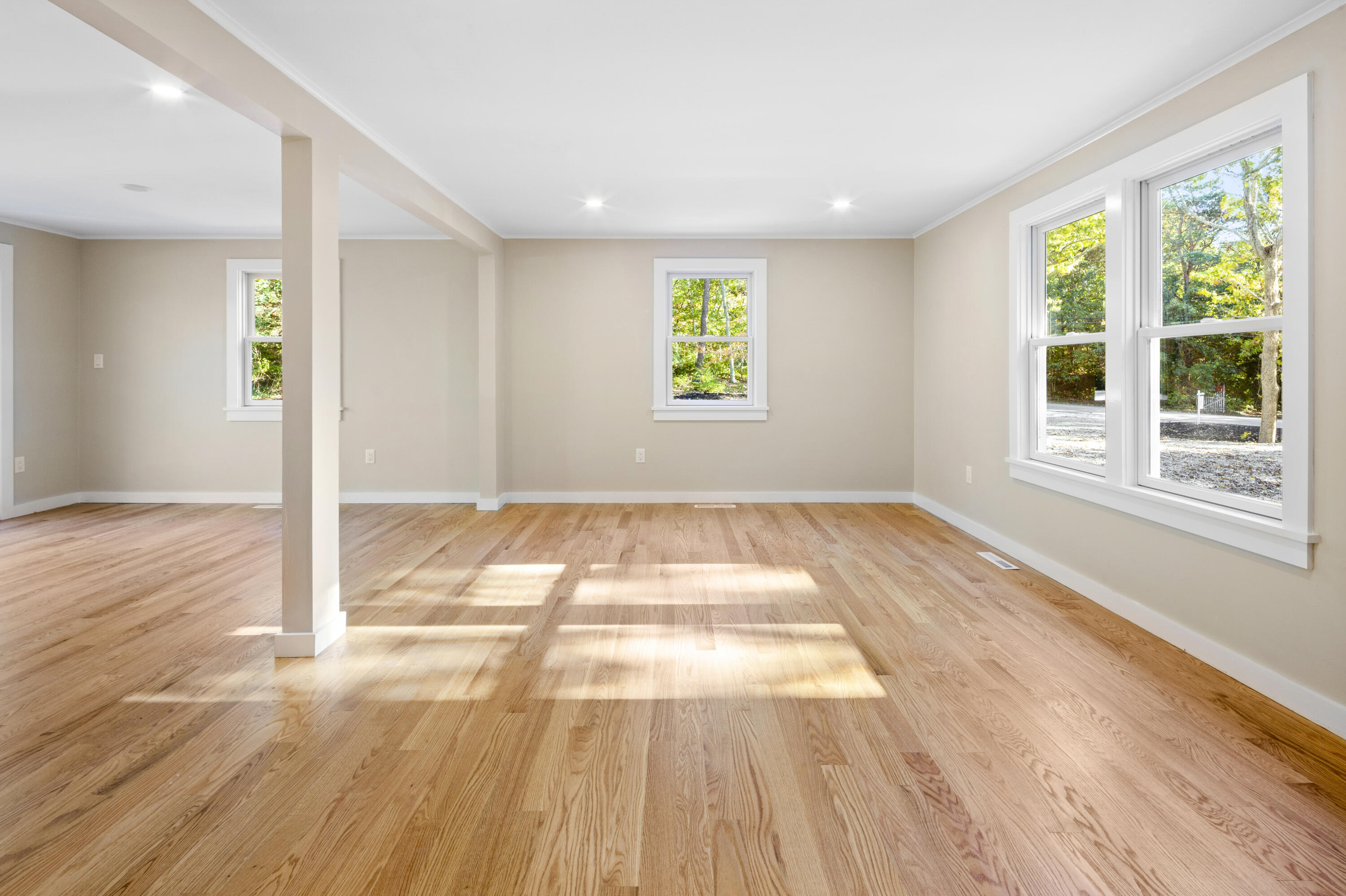 145 Stony Brook Road Brewster, MA 02631 - Photo 14 of 42 a view of an empty room with wooden floor and a window