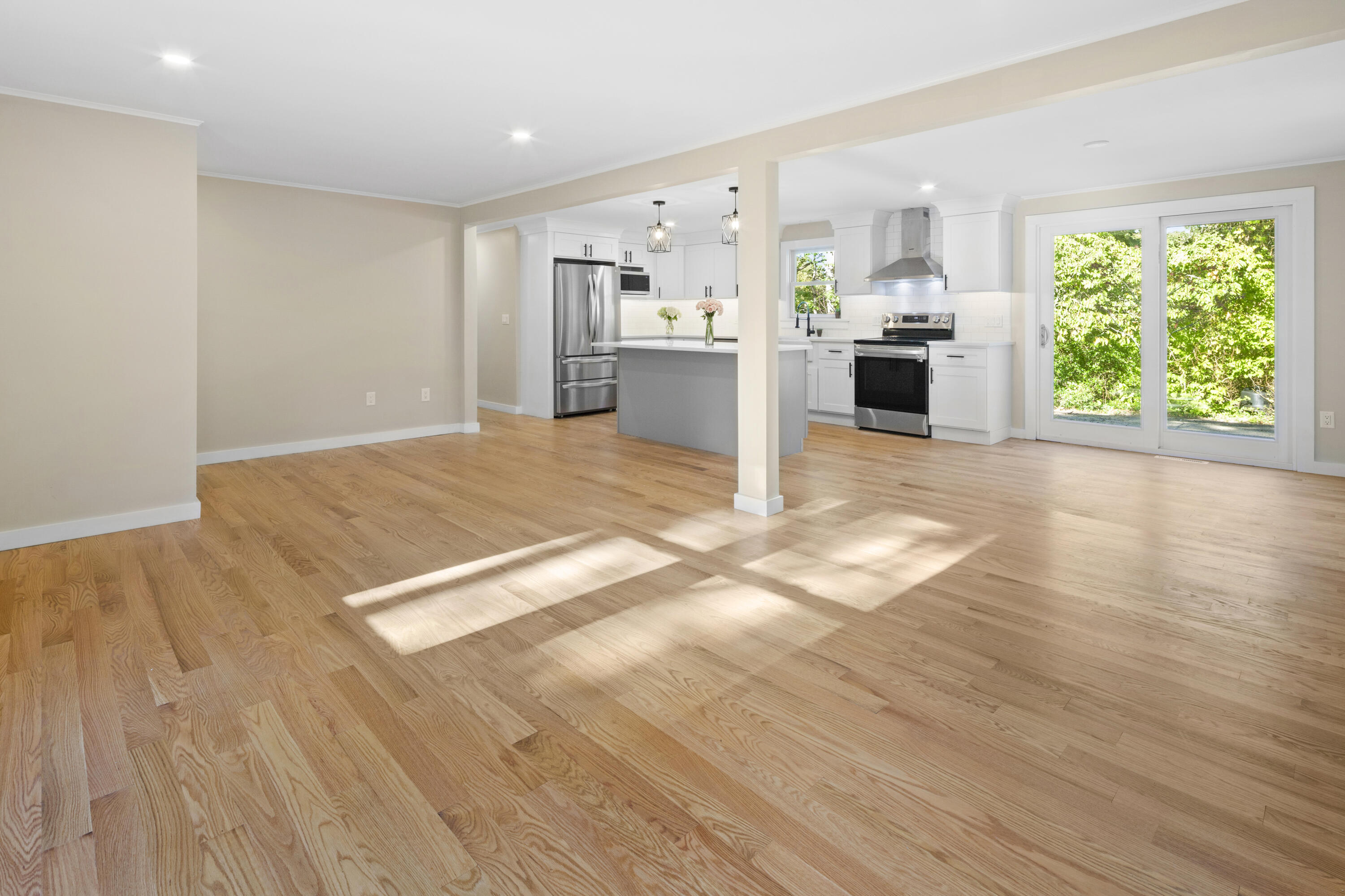 145 Stony Brook Road Brewster, MA 02631 - Photo 16 of 42 a view of a kitchen with wooden floor and windows