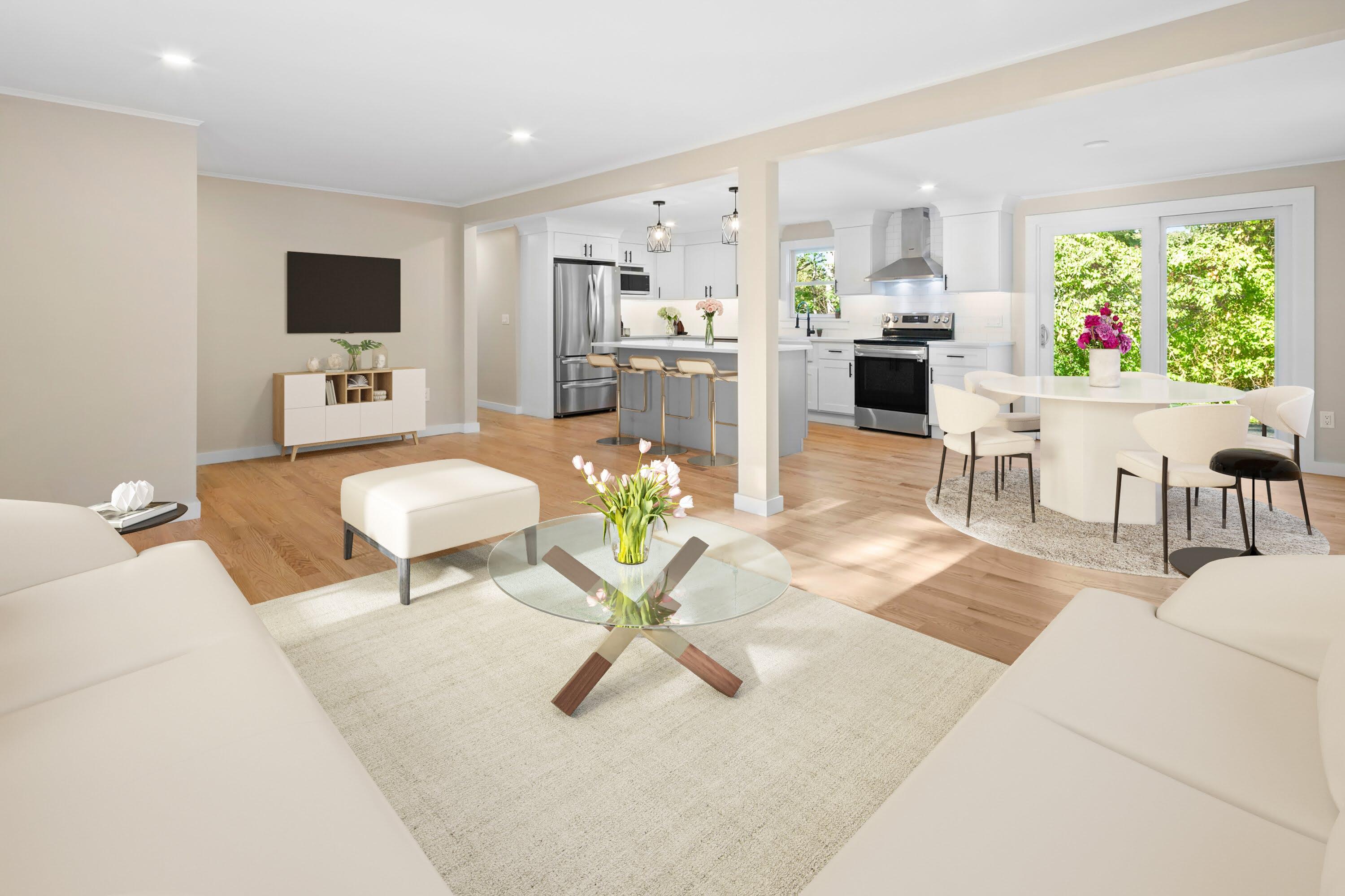 145 Stony Brook Road Brewster, MA 02631 - Photo 17 of 42 a living room with furniture a flat screen tv and a large window