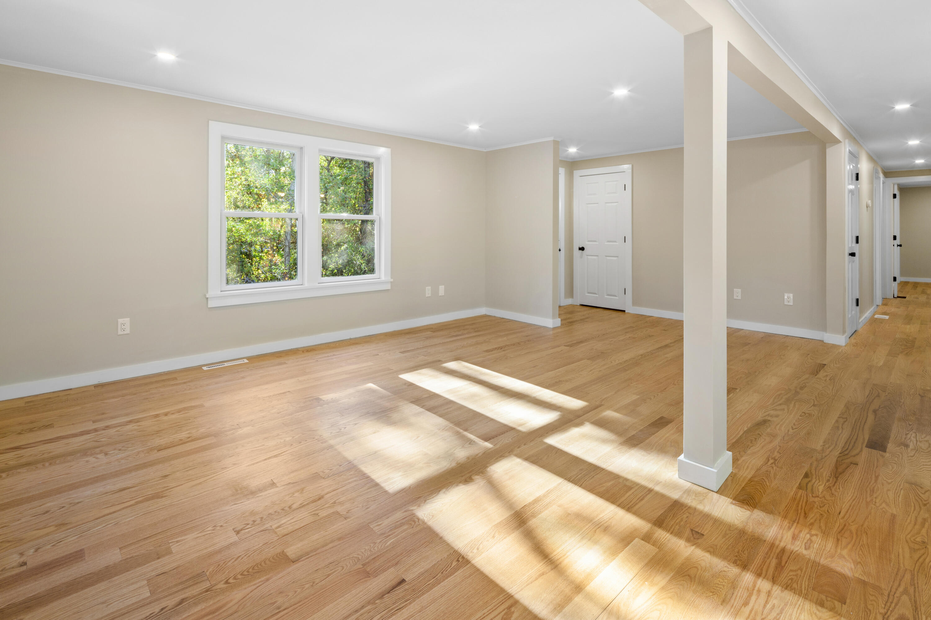 145 Stony Brook Road Brewster, MA 02631 - Photo 20 of 42 a view of an empty room with wooden floor and a window