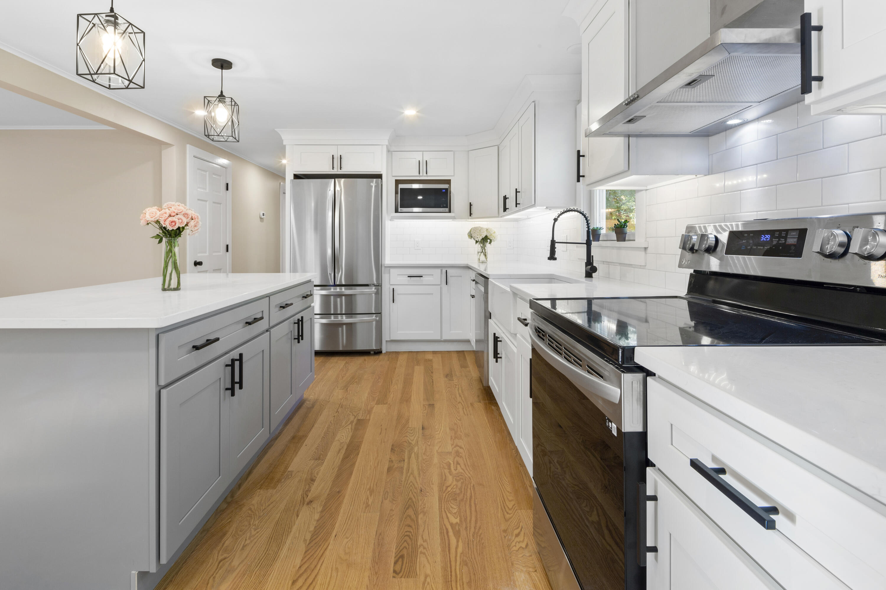 145 Stony Brook Road Brewster, MA 02631 - Photo 22 of 42 a kitchen with stove a sink and cabinets