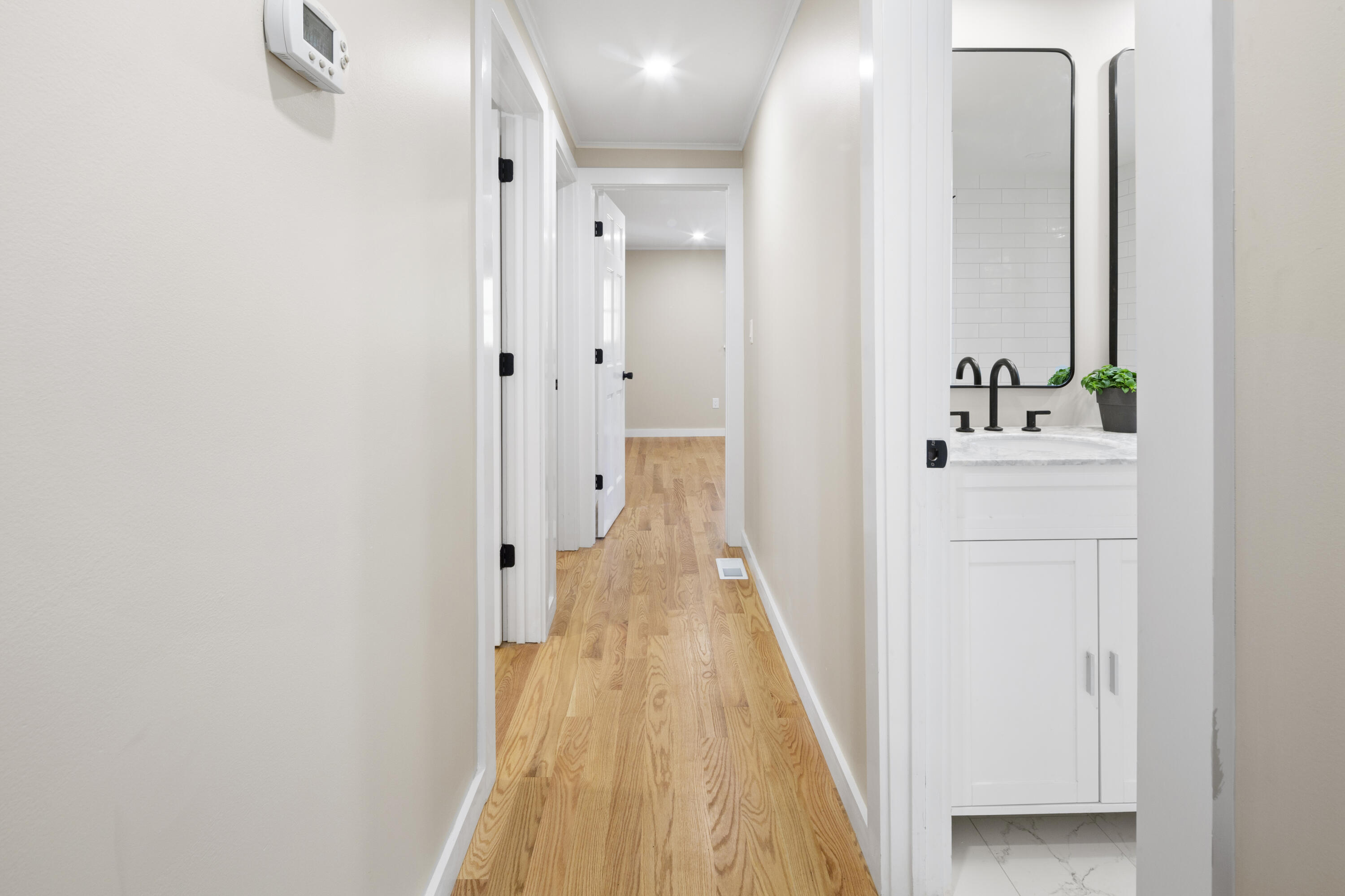 145 Stony Brook Road Brewster, MA 02631 - Photo 24 of 42 a view of a hallway with wooden floor and staircase