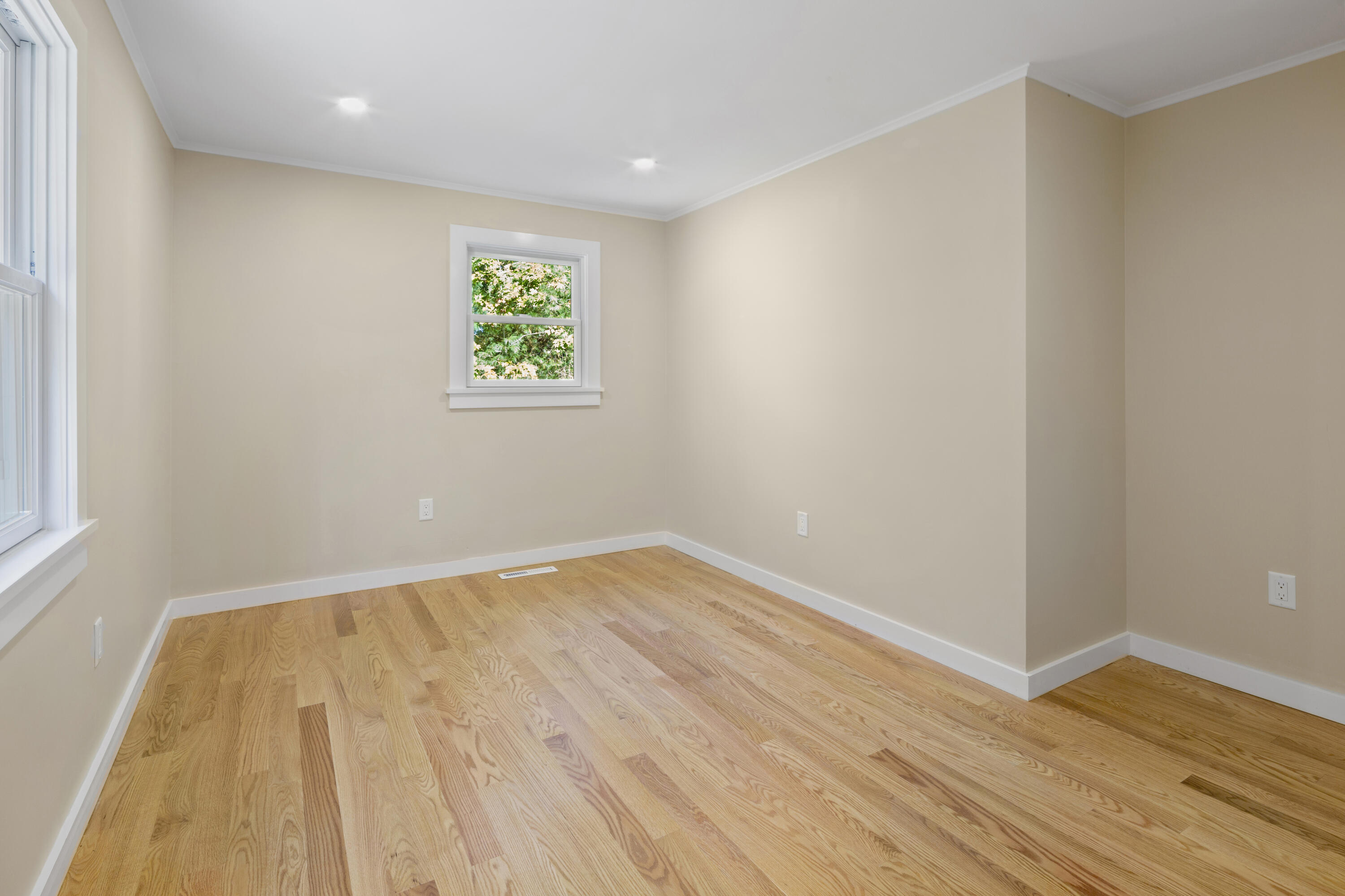 145 Stony Brook Road Brewster, MA 02631 - Photo 32 of 42 a view of an empty room with wooden floor and a window