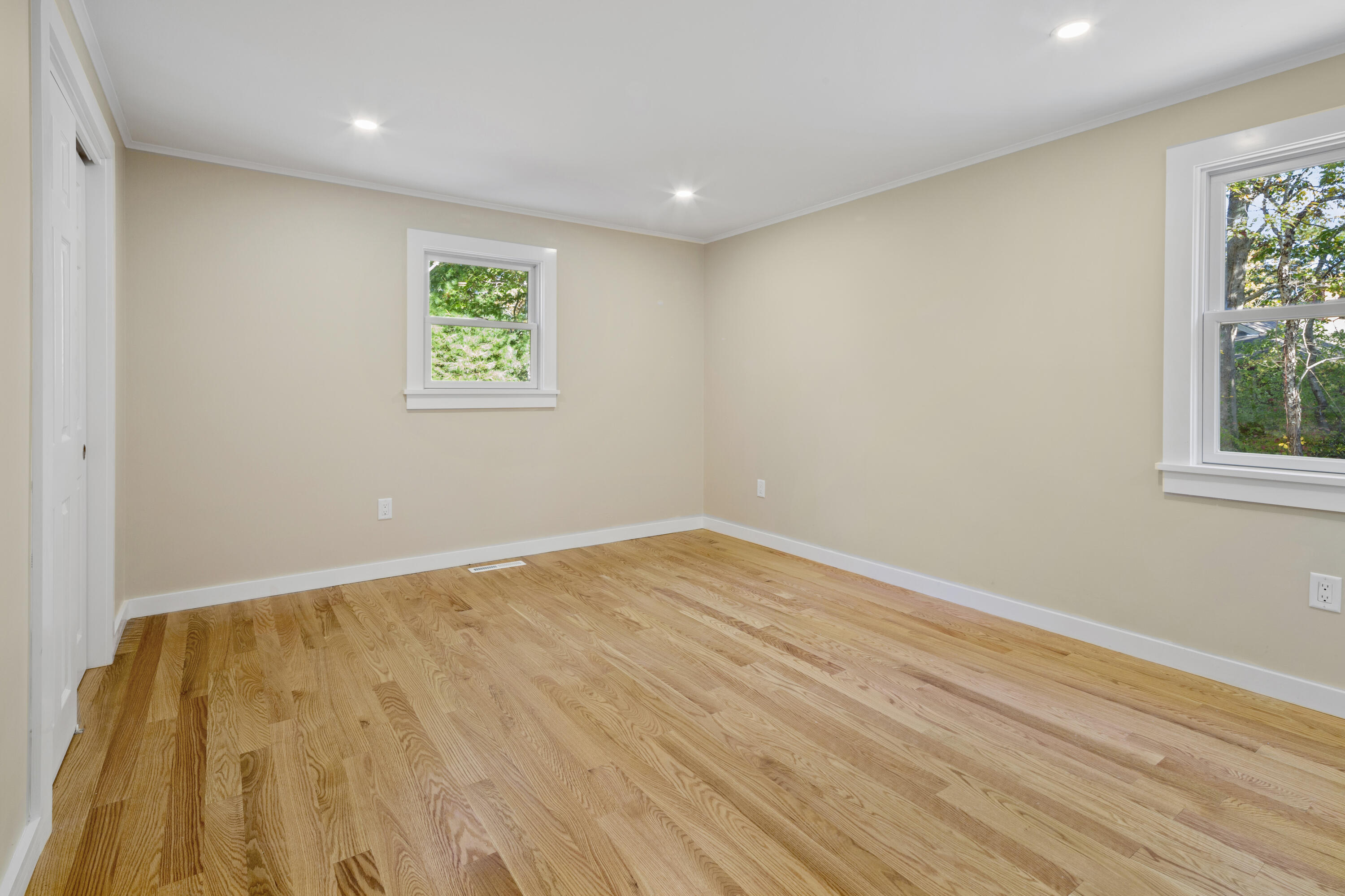 145 Stony Brook Road Brewster, MA 02631 - Photo 35 of 42 a view of an empty room with wooden floor and a window