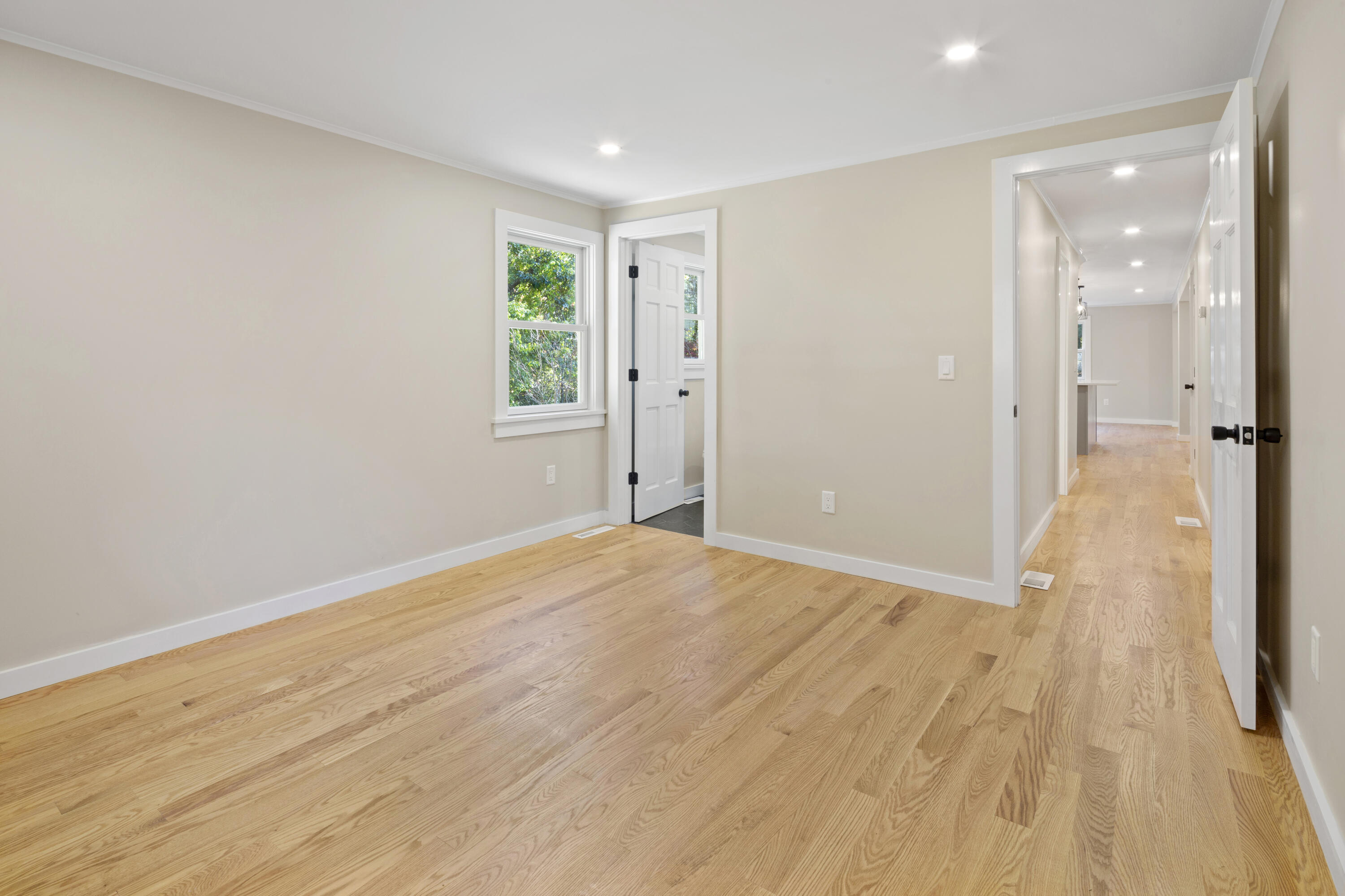 145 Stony Brook Road Brewster, MA 02631 - Photo 37 of 42 a view of a livingroom with wooden floor and a bathroom