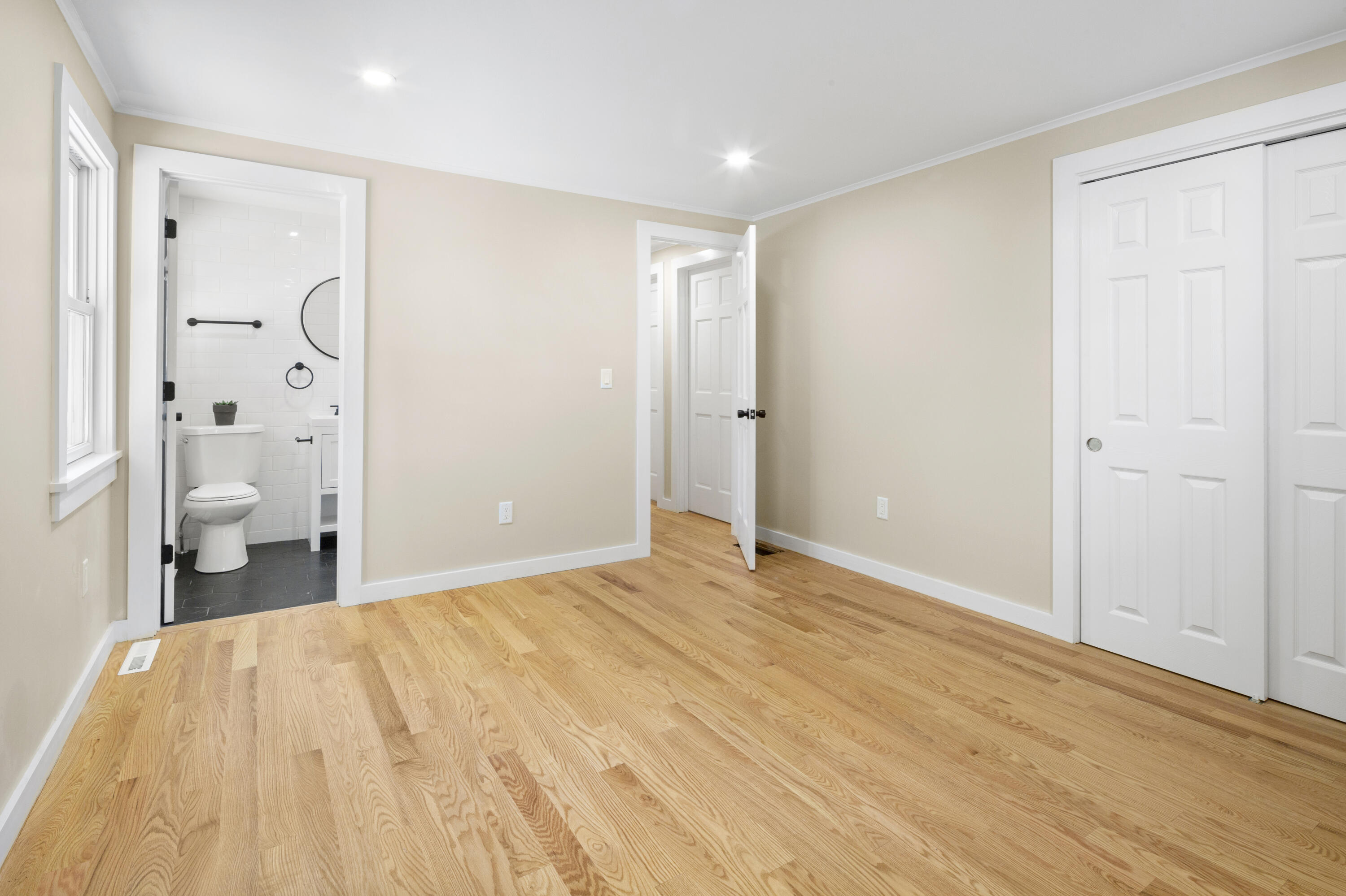 145 Stony Brook Road Brewster, MA 02631 - Photo 38 of 42 a big room with wooden floor and a bathroom