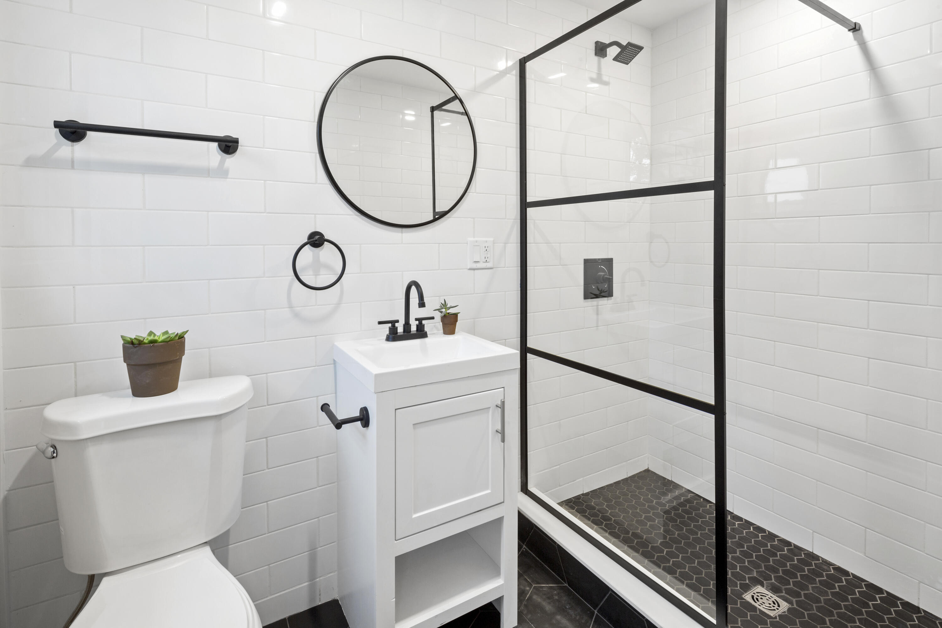 145 Stony Brook Road Brewster, MA 02631 - Photo 39 of 42 a bathroom with a sink toilet and a mirror