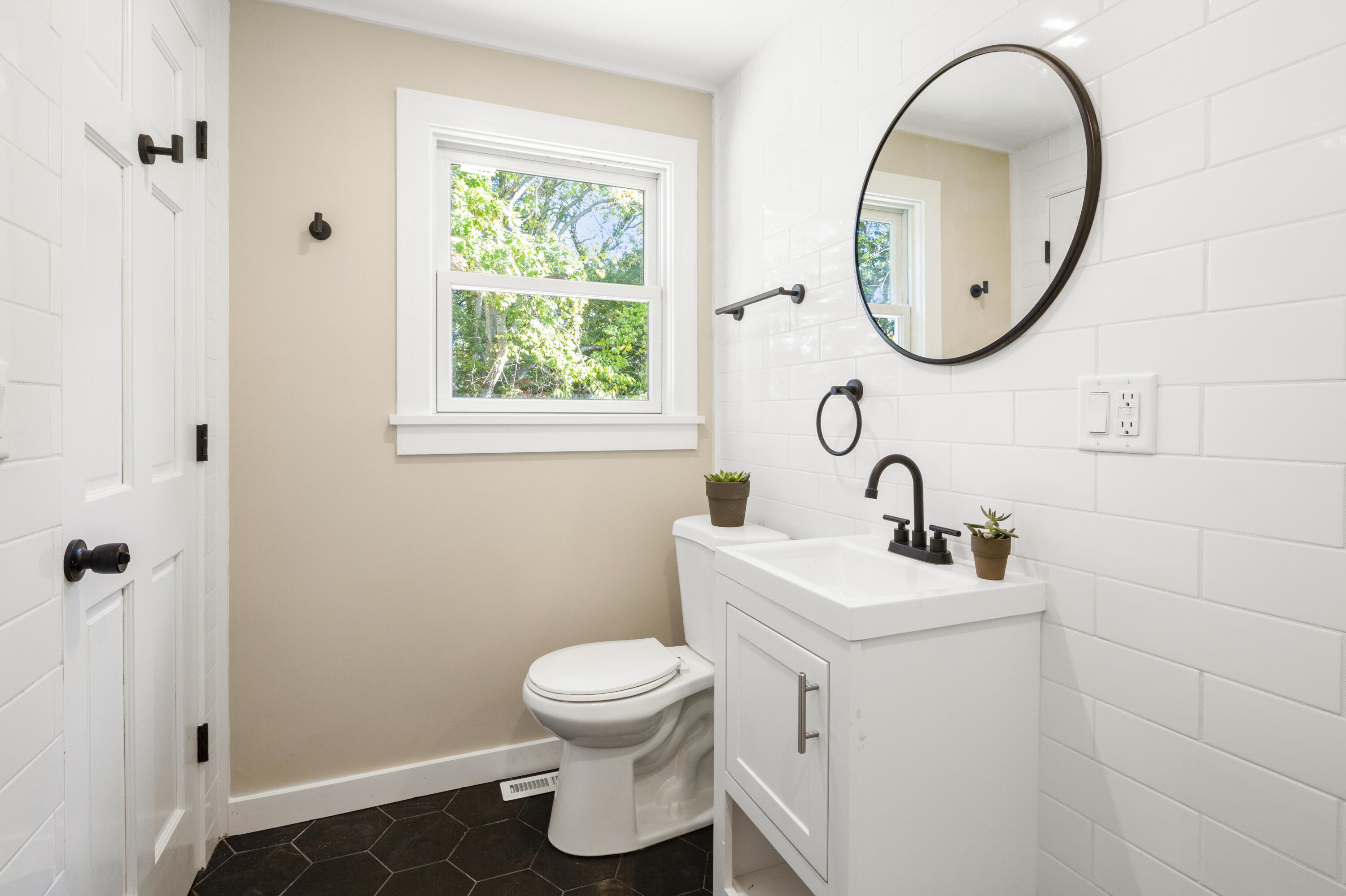 145 Stony Brook Road Brewster, MA 02631 - Photo 41 of 42 a bathroom with a sink toilet and a mirror