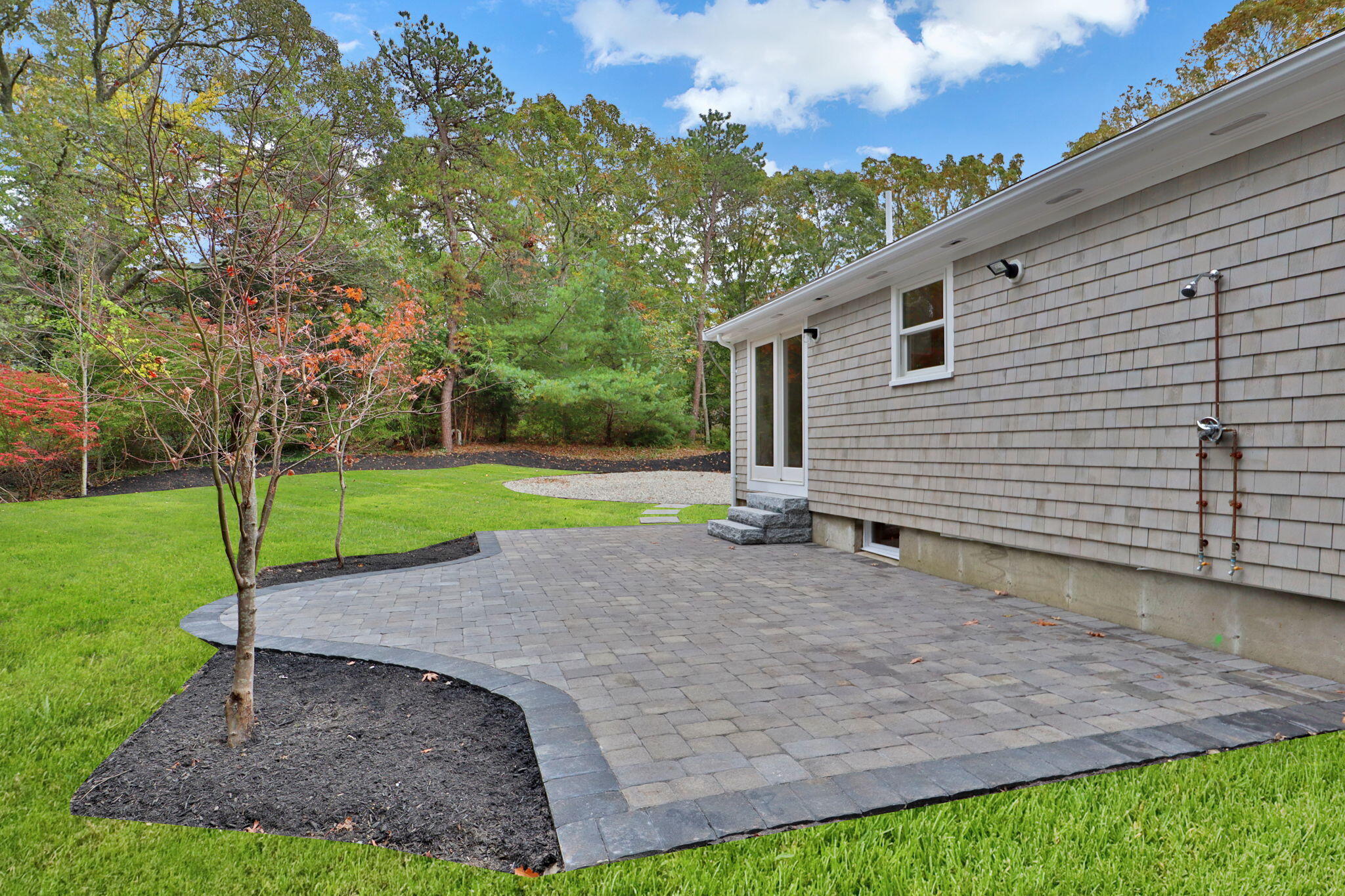 145 Stony Brook Road Brewster, MA 02631 - Photo 6 of 42 a view of a backyard with a garden