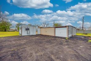 1717 Pipeline Road Cleburne, TX 76033 - Photo 21 of 26 a view of a house with a yard and a garage