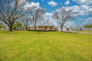 1717 Pipeline Road Cleburne, TX 76033 - Photo 23 of 26 a view of a building with a yard