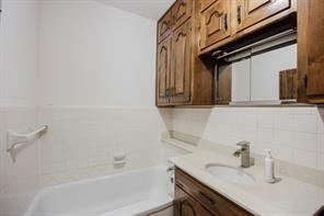1717 Pipeline Road Cleburne, TX 76033 - Photo 3 of 26 a bathroom with a sink and a bathtub